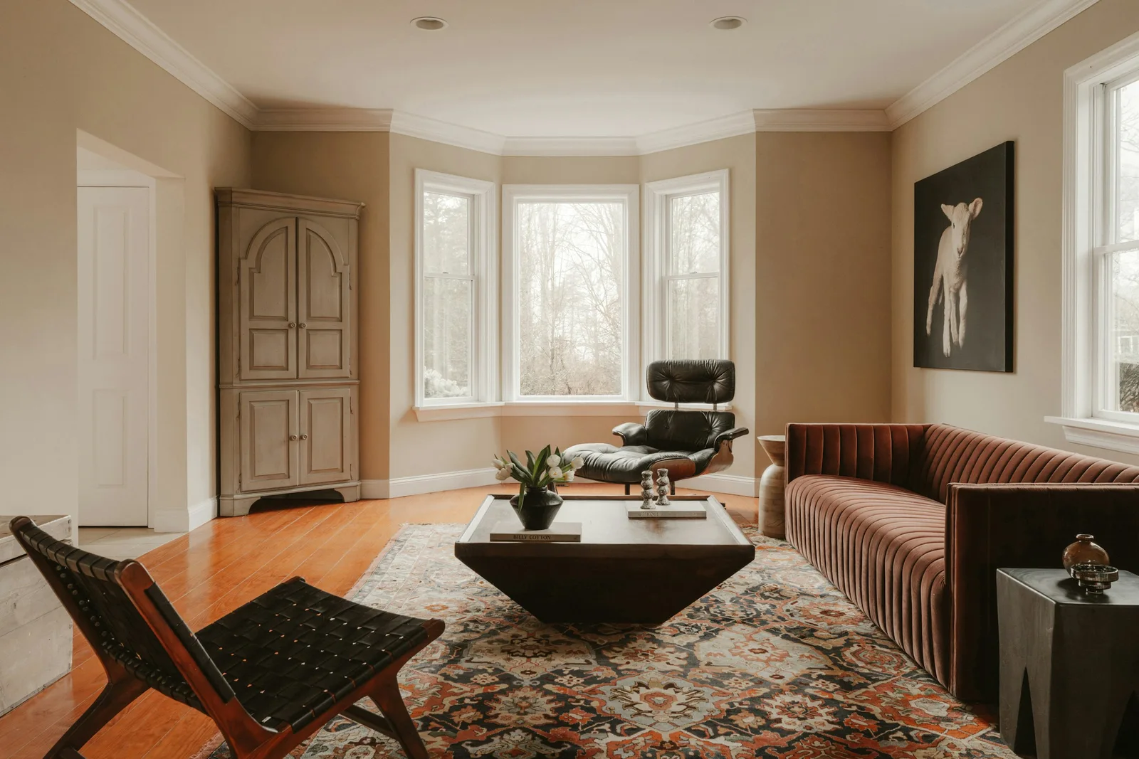 Design inspiration: a sunlit living room with warm walls and detailed trim; not Superior work